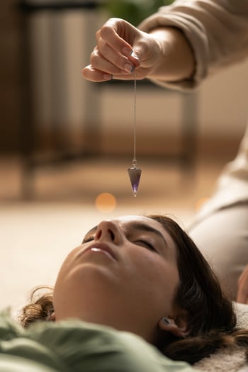 person-conducting-reiki-therapy