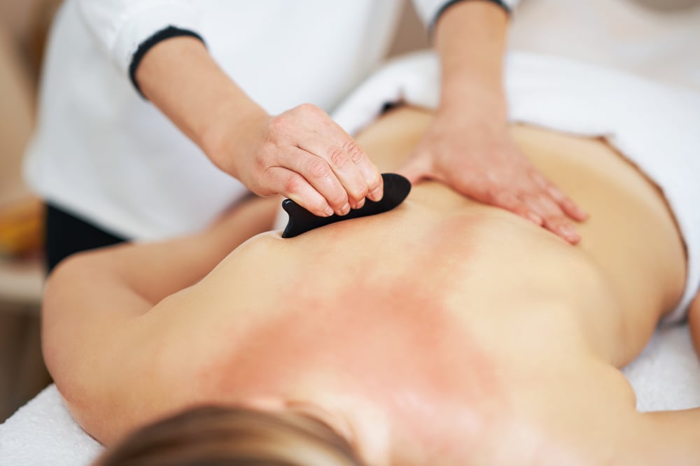 woman-having-a-gua-sha-massage-in-salon-2023-11-27-04-56-45-utc